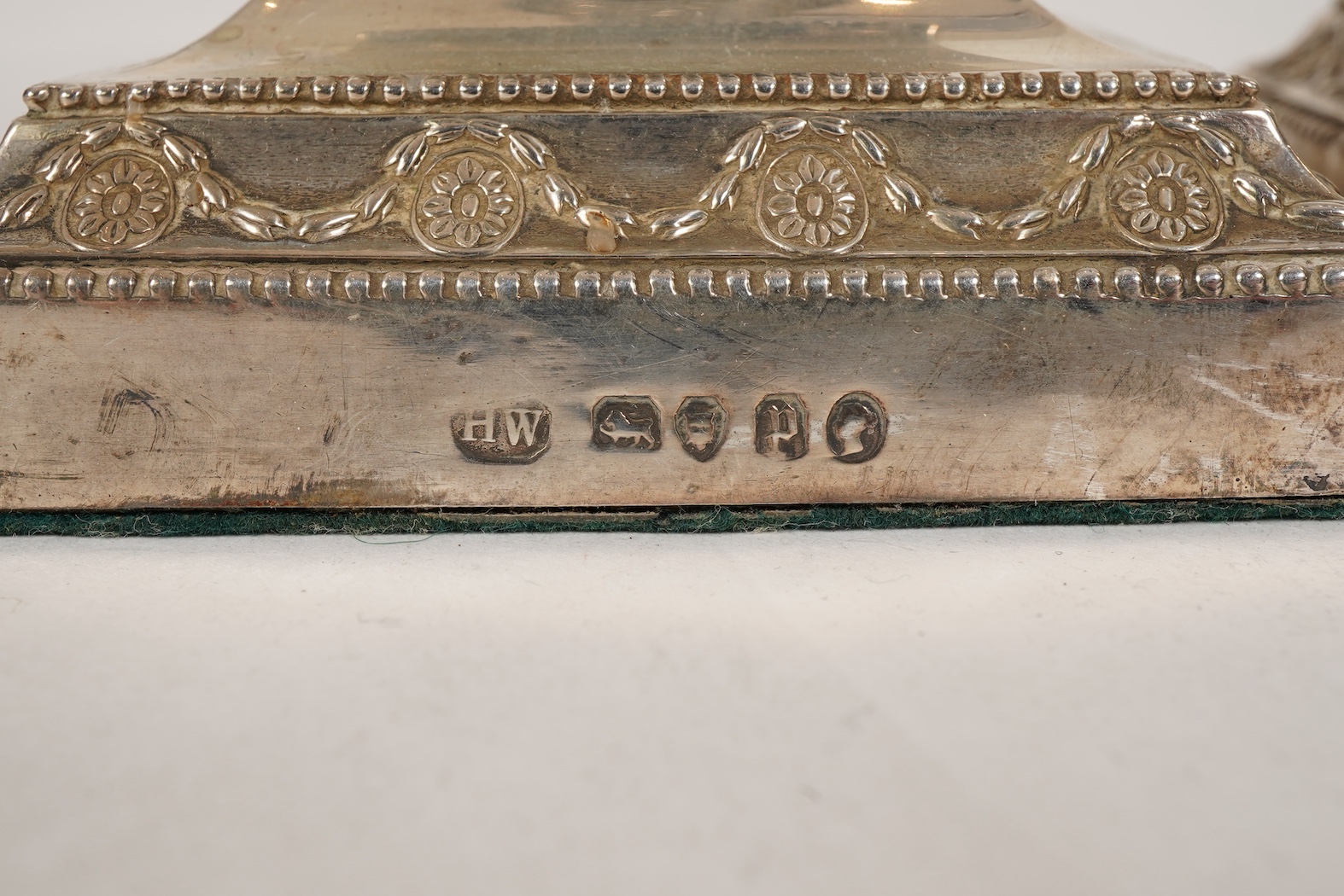 A pair of Victorian silver candlesticks, with fixed sconces, by Henry Wilkinson & Co